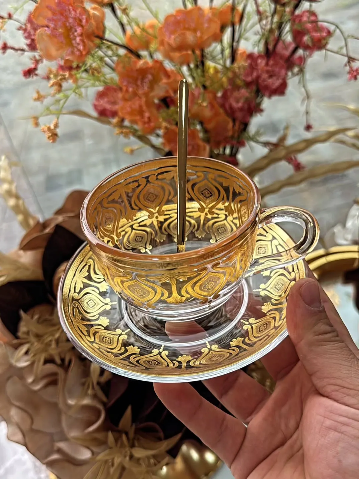 Gold Ornamented Glass Cup and Saucer Set