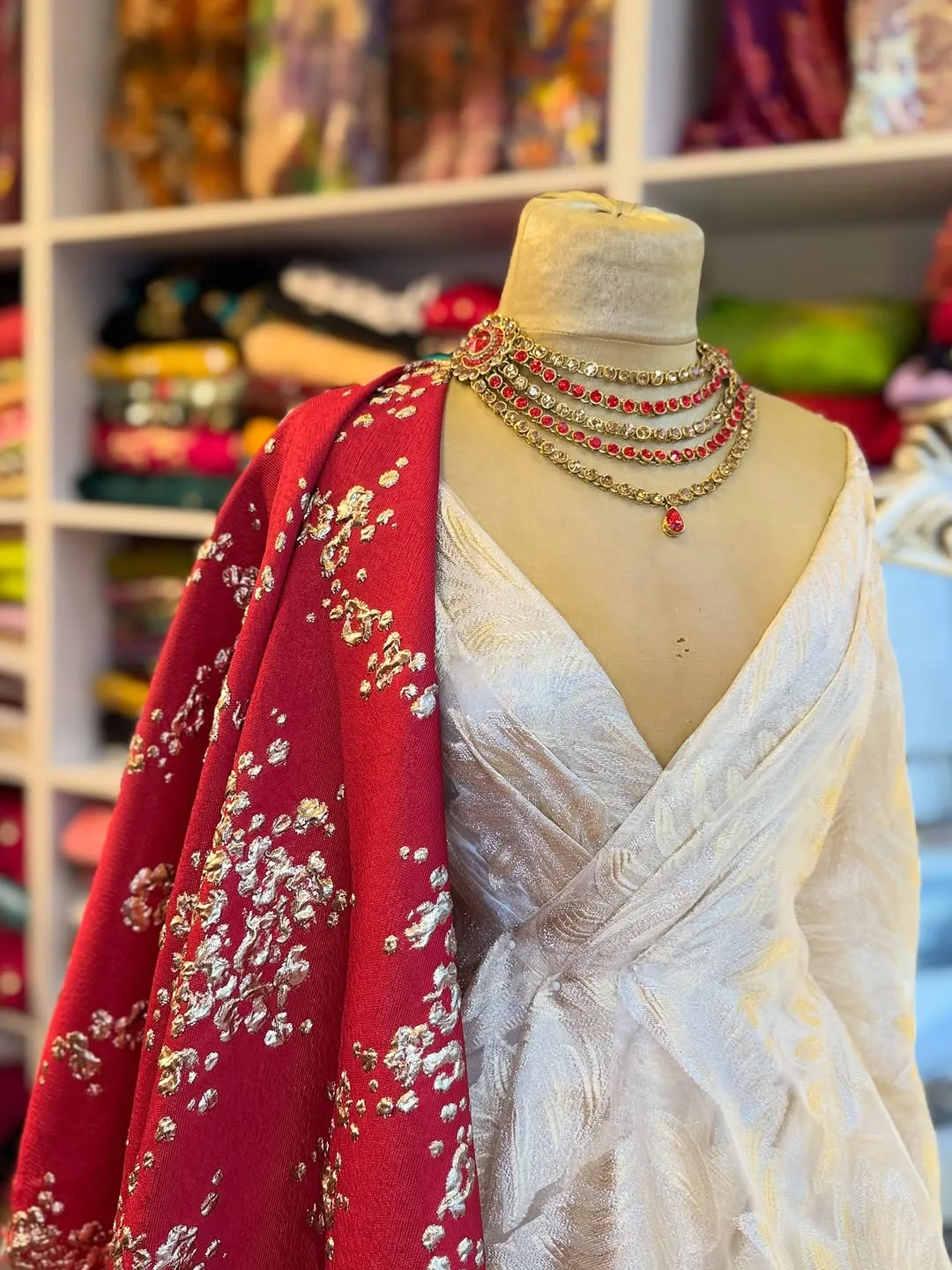 White Traditional Dress with Red Embroidered Shawl and Gold Necklace
