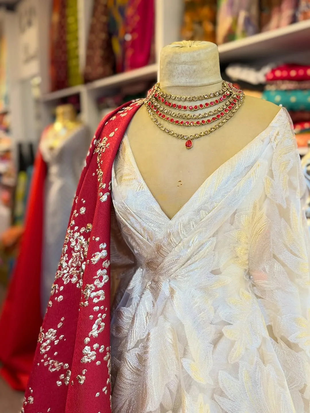 White Traditional Dress with Red Embroidered Shawl and Gold Necklace
