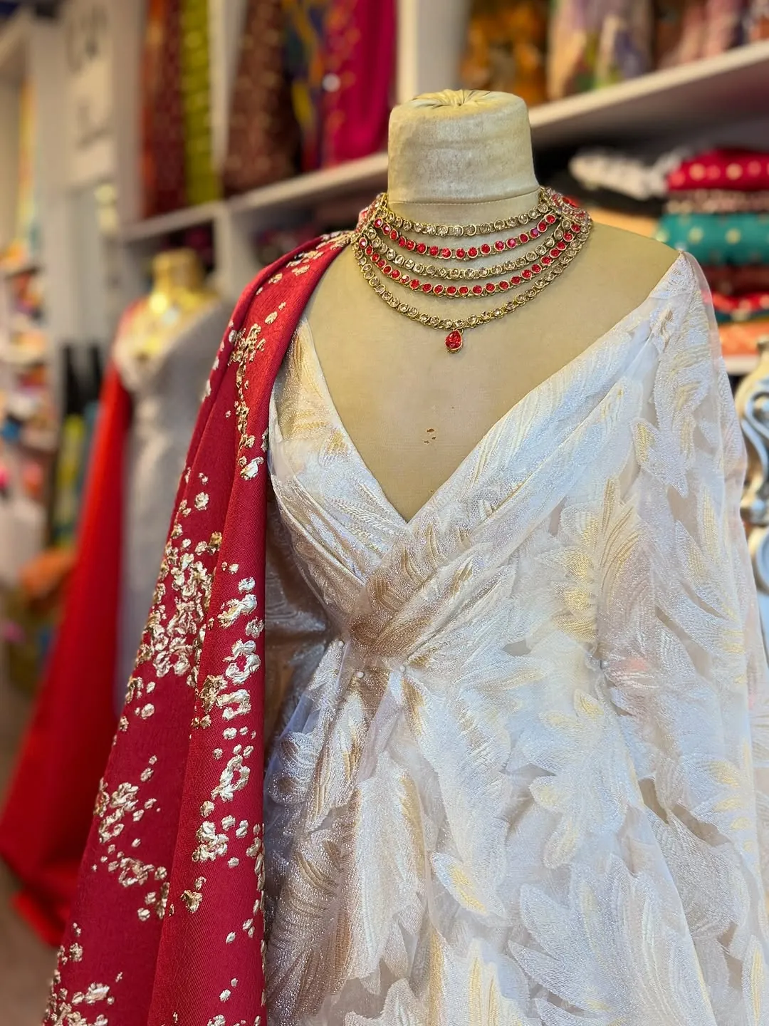 White Traditional Dress with Red Embroidered Shawl and Gold Necklace