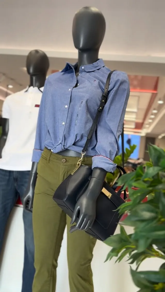 Women's Blue Shirt and Black Handbag